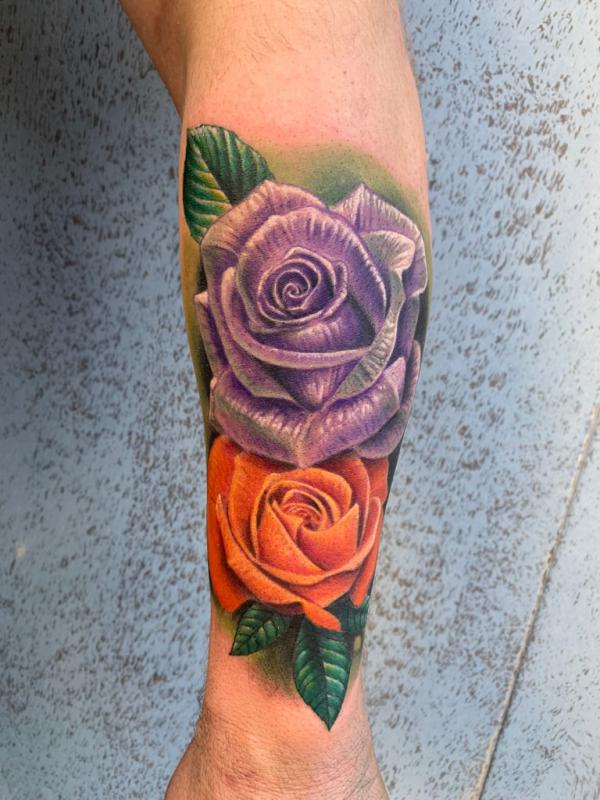 Purple and orange roses tattoo