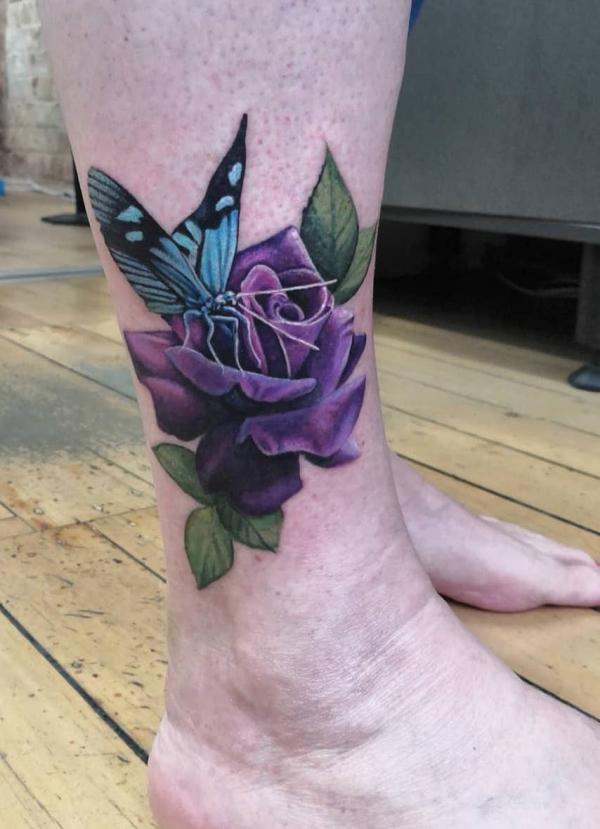 Purple rose and blue butterfly tattoo