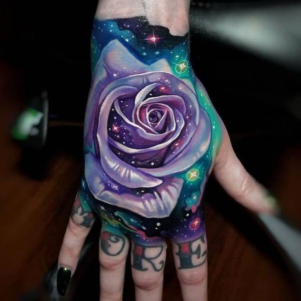 Purple rose hand tattoo