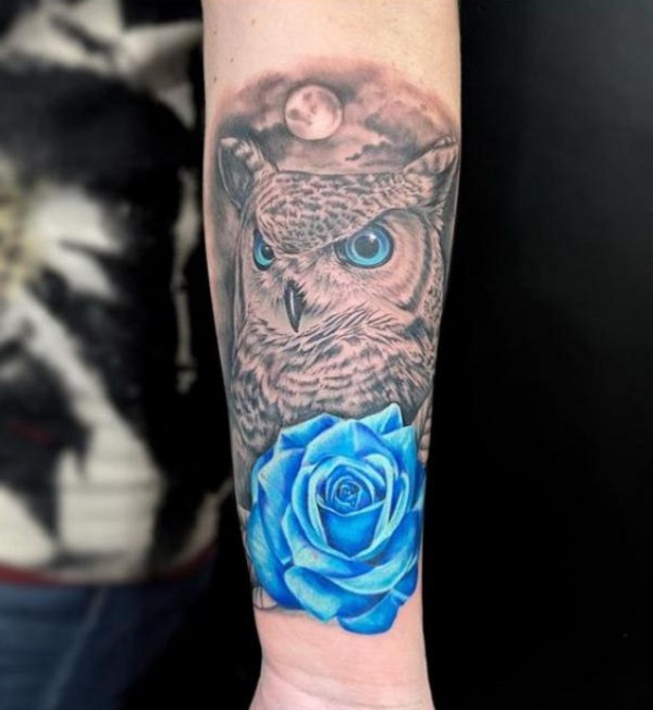 Realistic blue rose and black and grey owl tattoo