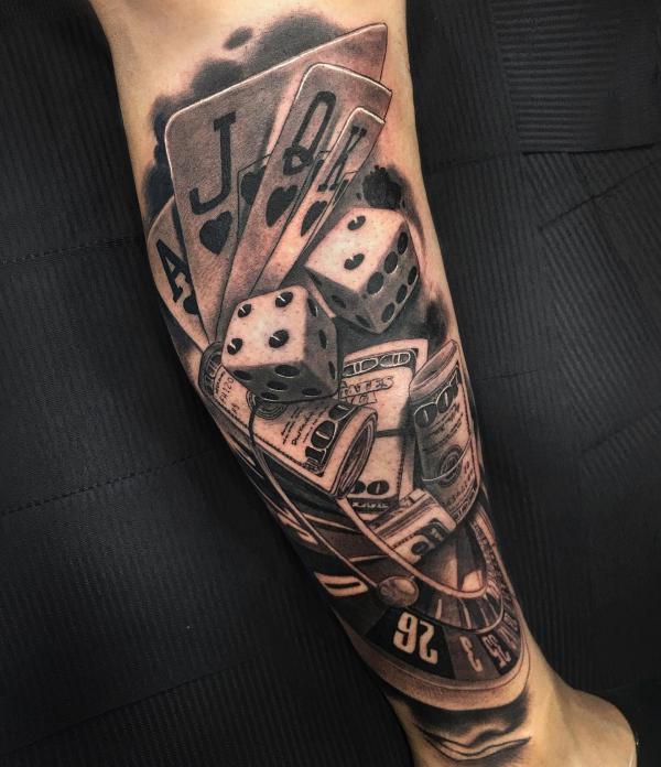 Realistic cards dices and money tattoo forearm