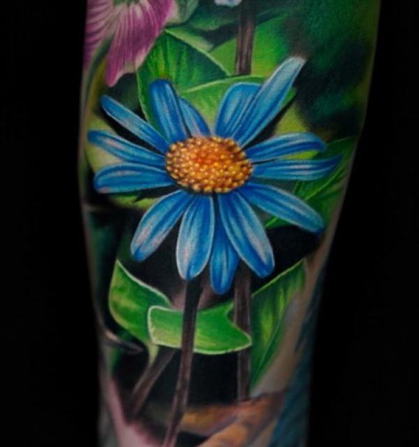 Realistic daisy tattoo