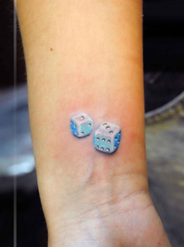 Realistic dices wrist tattoo