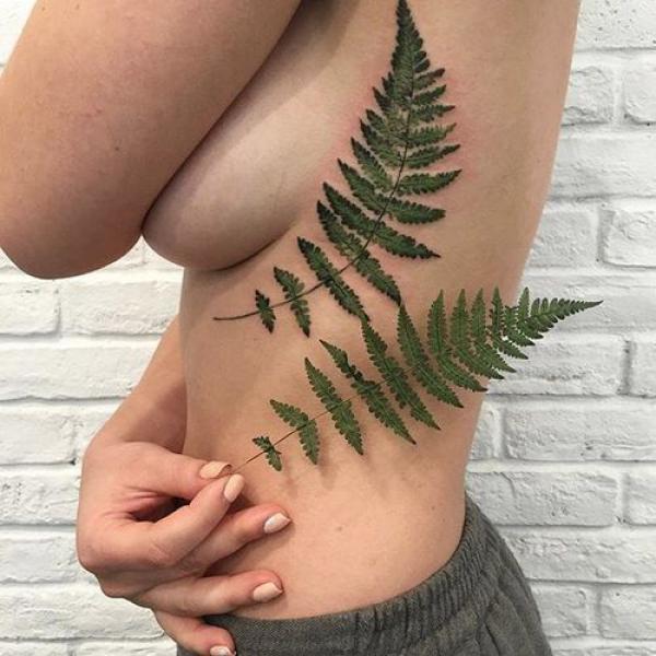 Realistic fern side boob tattoo