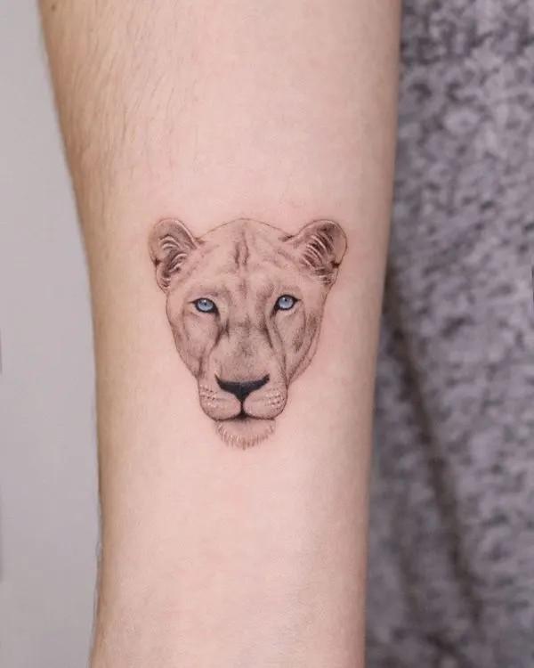 Realistic lioness head tattoo