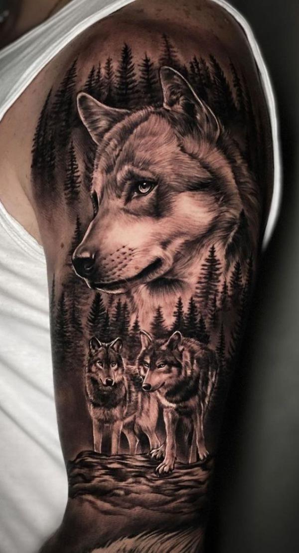 Realistic wolf family tattoo on upper arm
