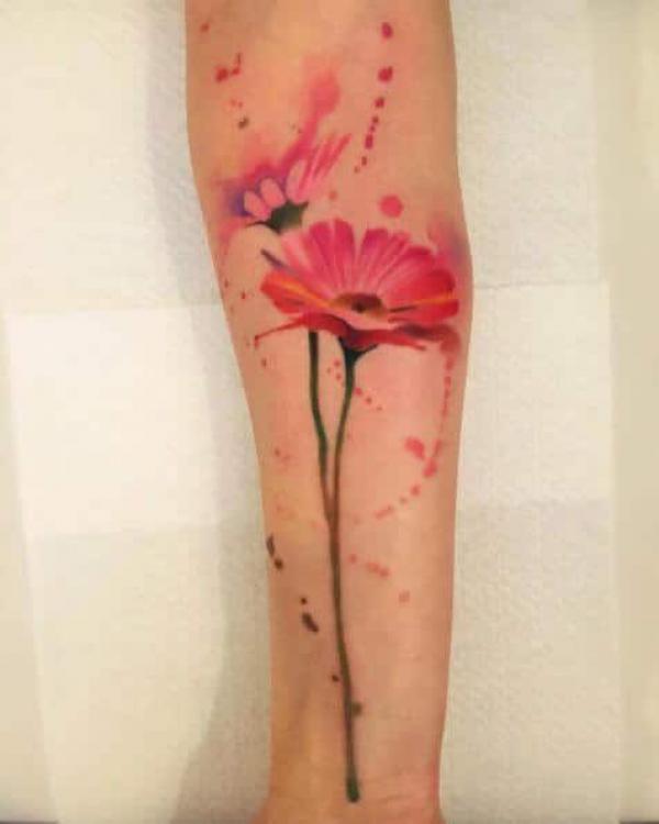 Red daisy tattoo