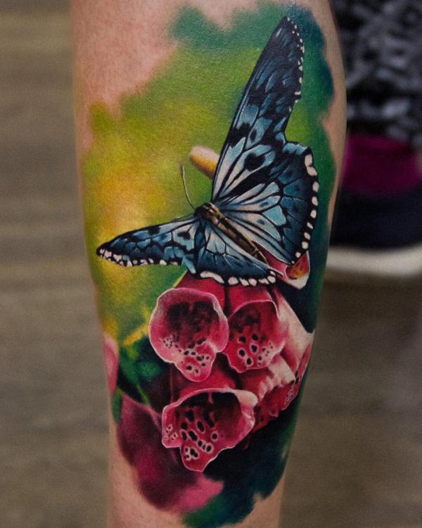 Red foxglove and blue butterfly tattoo