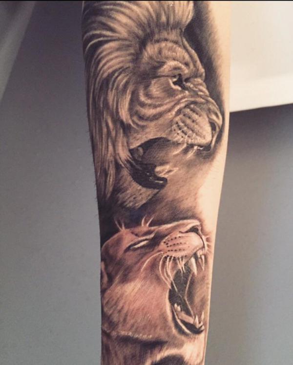 Roaring lion king and lioness tattoo sleeve