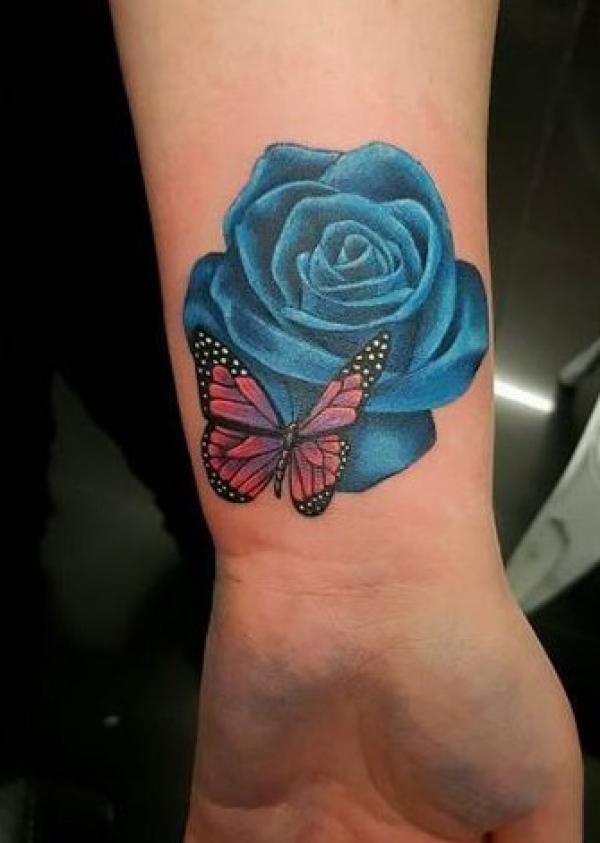 Rose and butterfly wrist tattoo