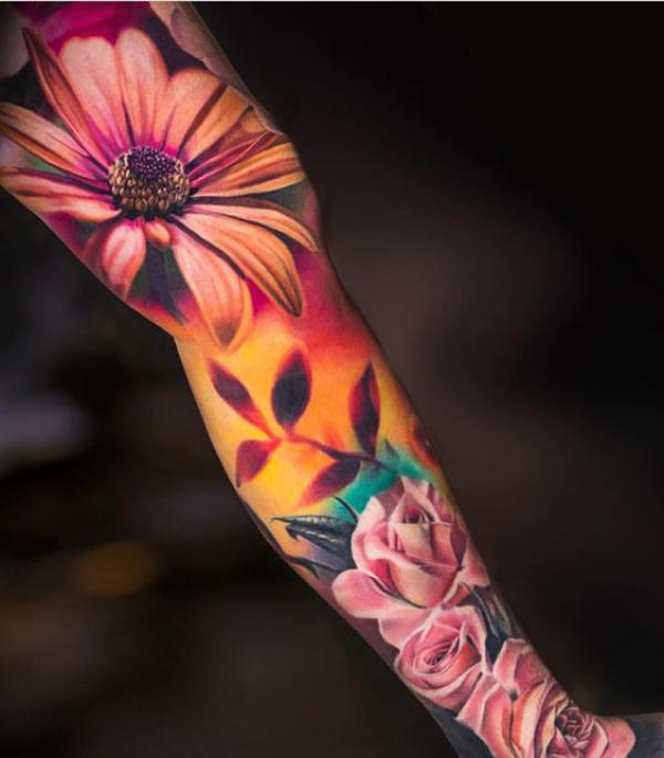 Rose and daisy leg tattoo