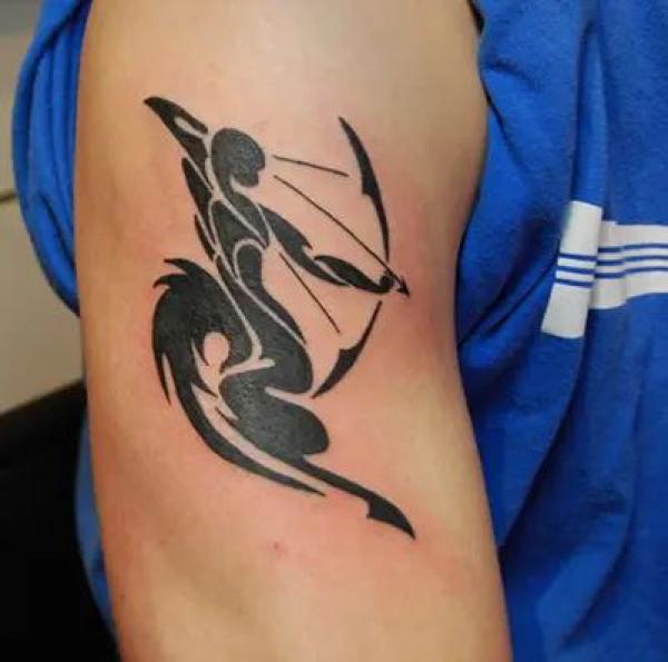 Sagittarius tribal upper arm tattoo 1