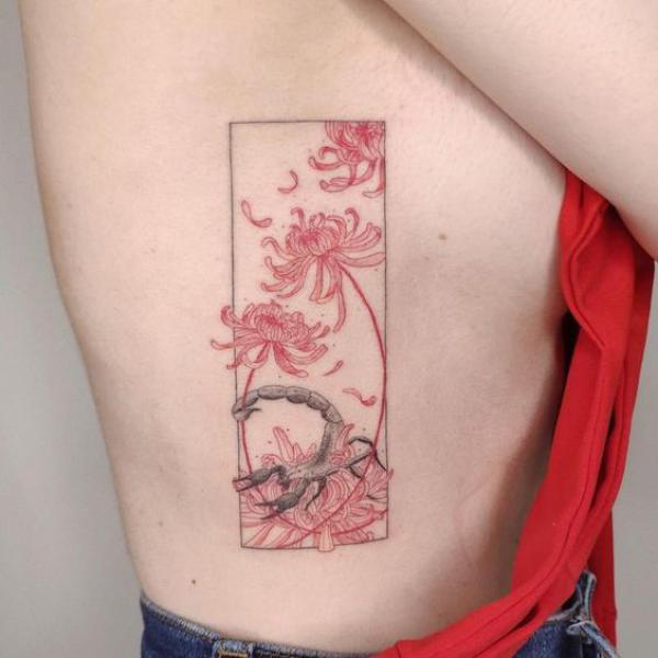 Scorpion and spider lily side boob tattoo