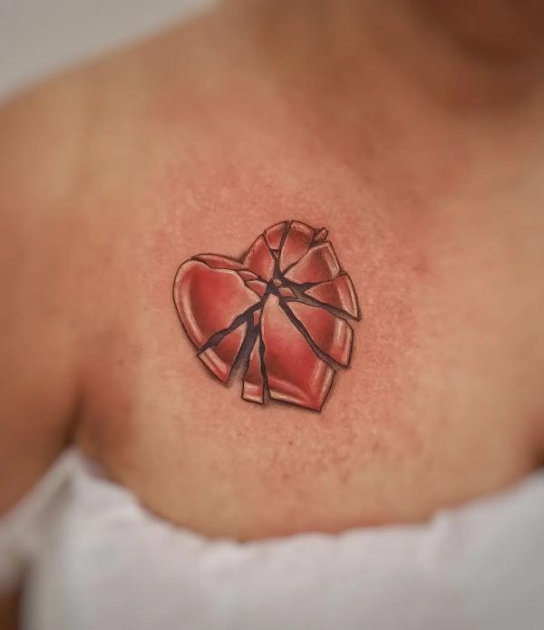 Shattered broken sacred heart chest tattoo