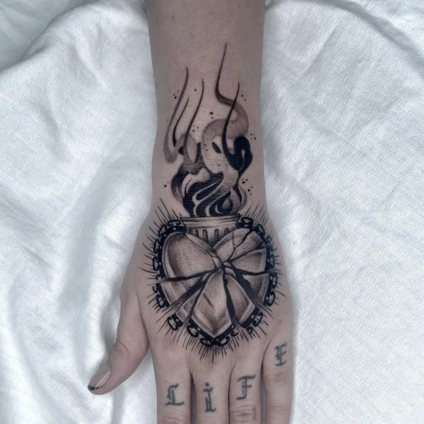 Shattered sacred heart hand tattoo