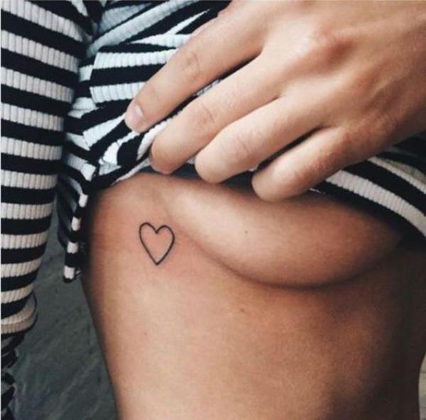 Simple heart side boob tattoo