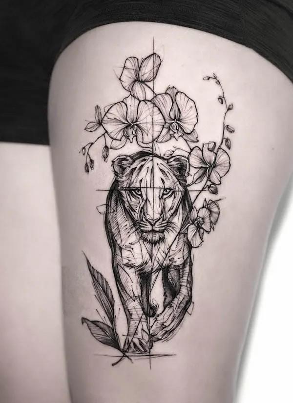 Sketchy lioness with flowers tattoo