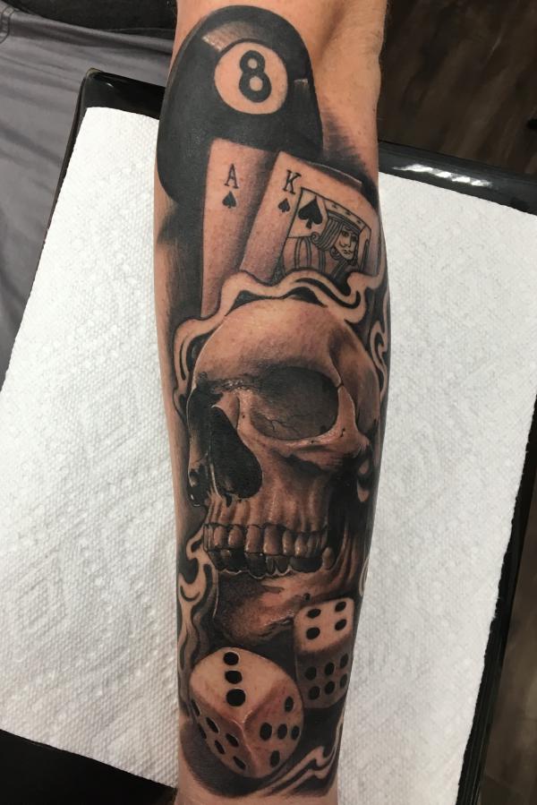 Skull with dices and cards tattoo