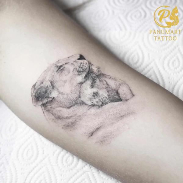 Sleeping lioness an d cub tattoo black and grey