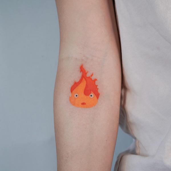 Small Calcifer elbow tattoo