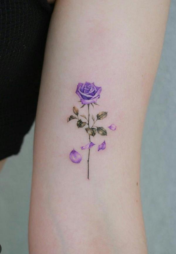 Small blue rose tattoo