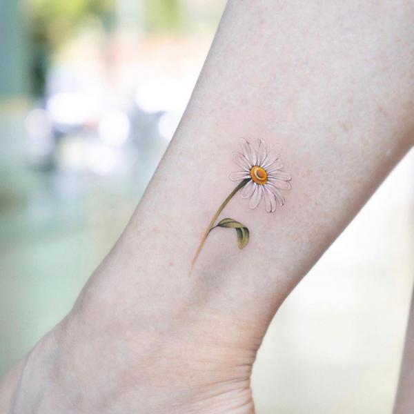 Small daisy ankle tattoo