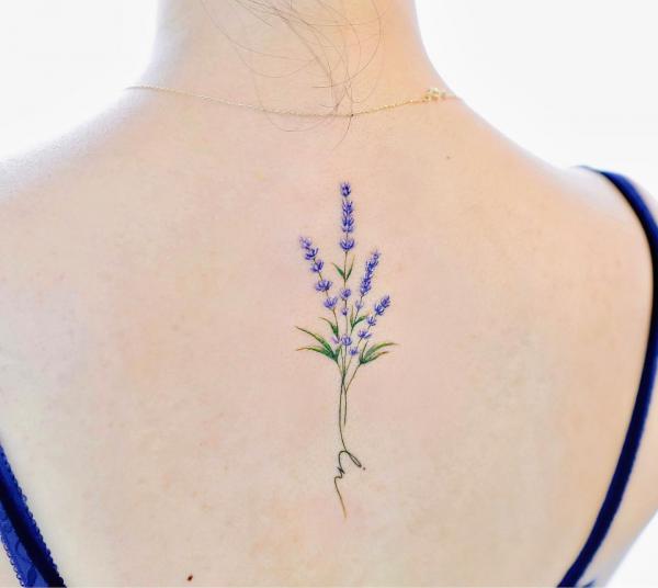 Small lavender back tattoo