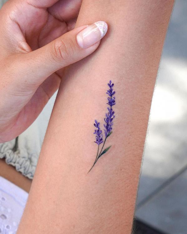 Small lavender tattoo on forearm