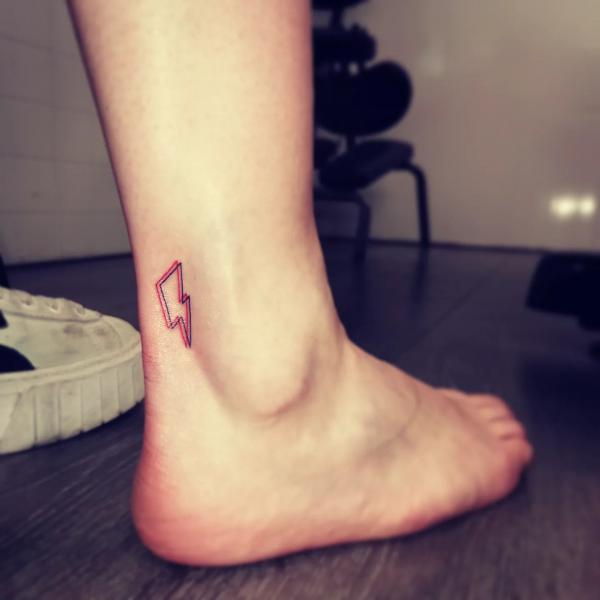 Small lightning heel tattoo