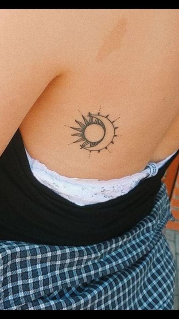 Small sun and moon side tattoo