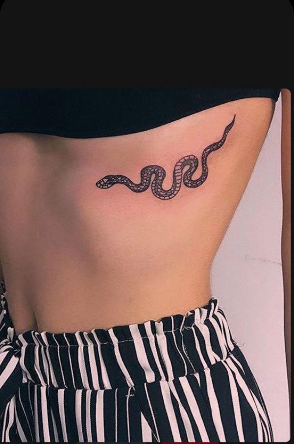 Snake side boob tattoo
