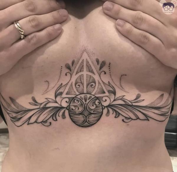 Snitch and deathly hallows sternum tattoo