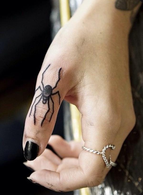 Spider finger tattoo