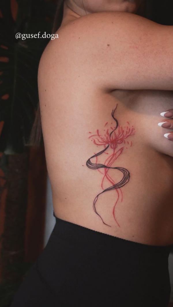 Spider lily side boob tattoo