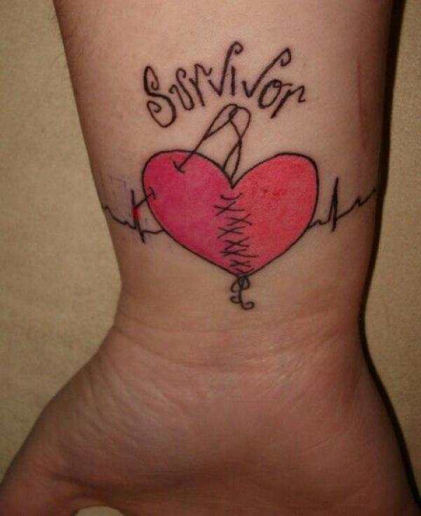 Stitched broken heart wrist tattoo with heartbeat and the word Survivor