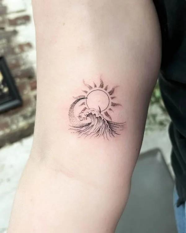 Sun and moon and wave tattoo