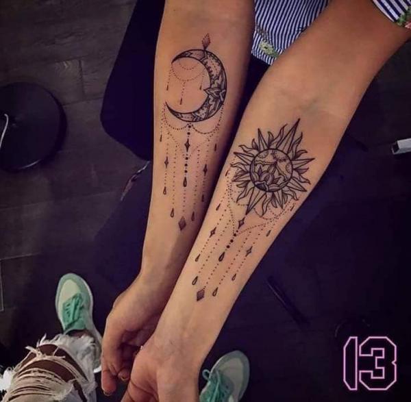 Sun and moon matching tattoos for sisters