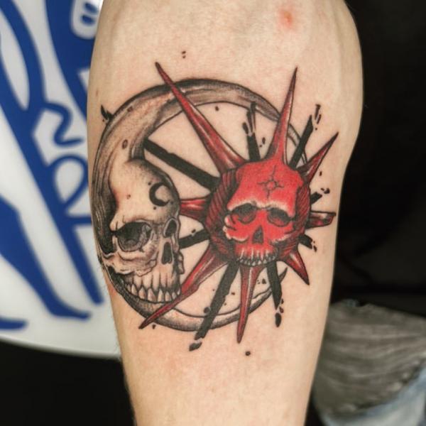 Sun and moon skull tattoo