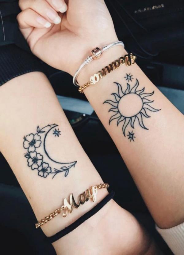 Sun and moon with flower and stars tattoo for sisters