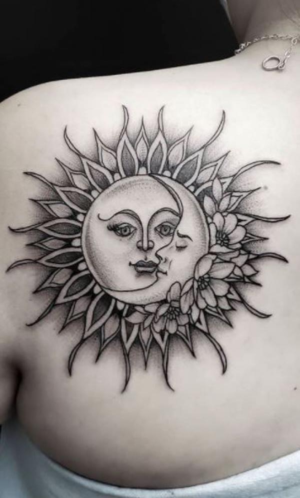 Sun and moon with flowers shoulder blade tattoo