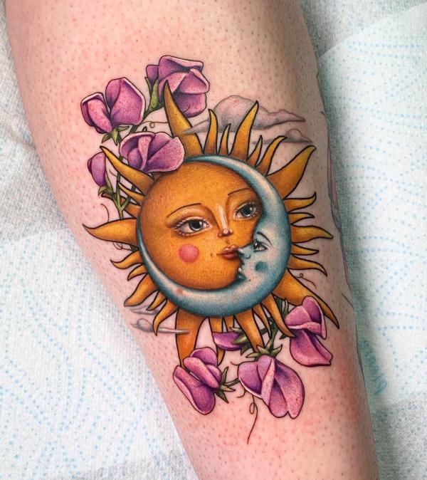 Sun and moon with iris tattoo