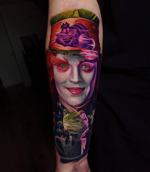 The Eccentric Hatter with frog forearm tattoo