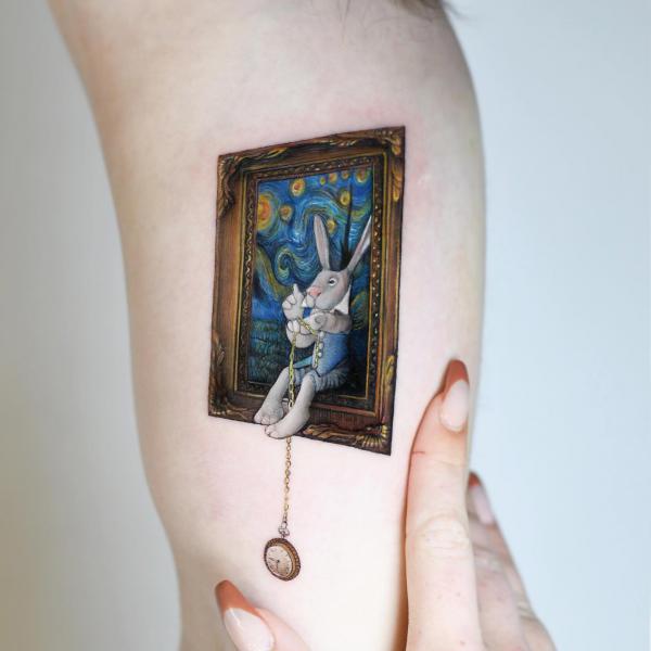 The white rabbit sitting on a picture frame of The Starry Night