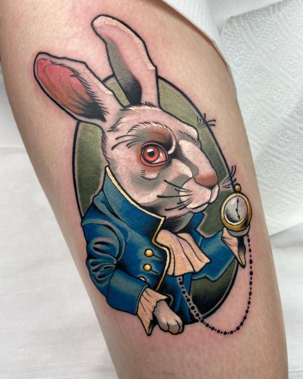 The white rabbit thigh tattoo