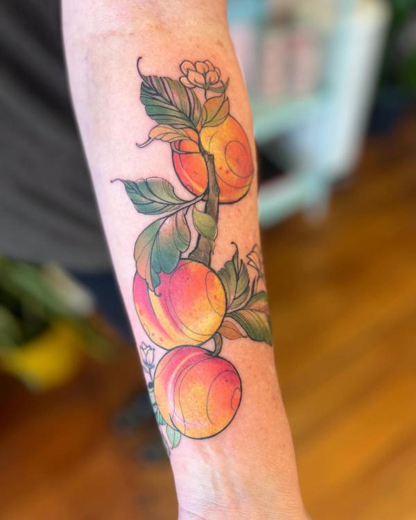 Three peaches forearm tattoo