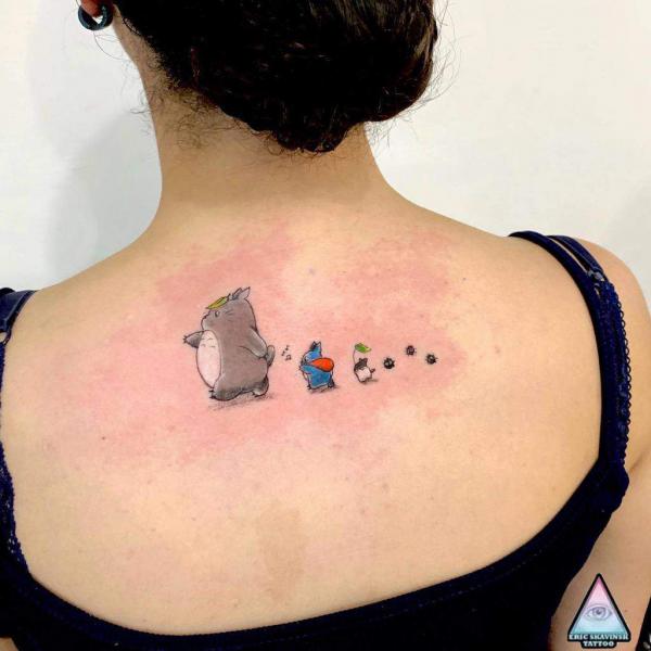 Three totoros walking with Soot Sprites tattoo on upper back