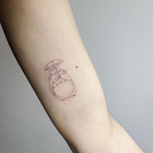 Totoro with umbrella line work tattoo