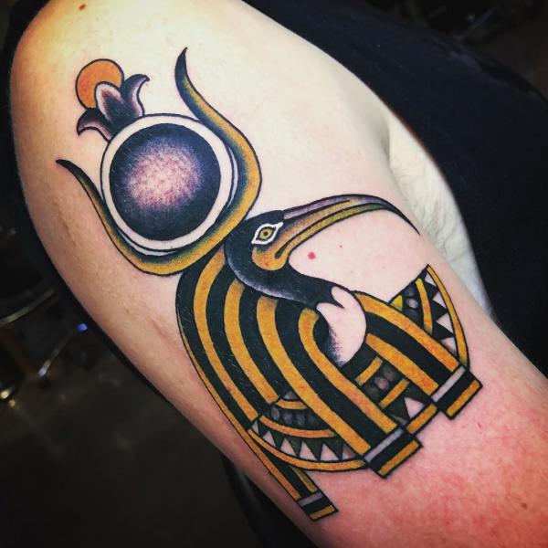 Traditional Thoth portrait tattoo on upper arm