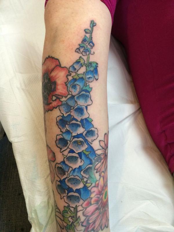 Traditional blue foxglove tattoo