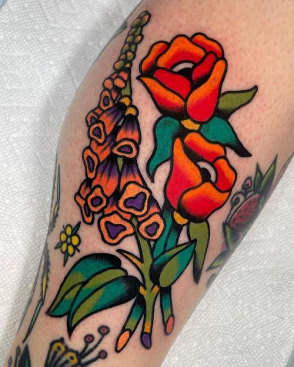 Traditional foxglove and rose tattoo